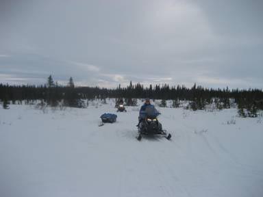 Marcy as we stopped between Selawik and Ambler where I gave my snowmachine to musher, Ken Anderson, to search for a dog that he lost in the hills. He had been out in front and lost at least theree hours but did find his dog.