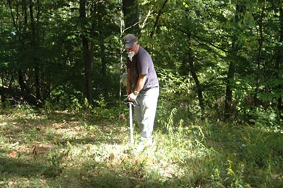 Uncle Don whips down weeds.