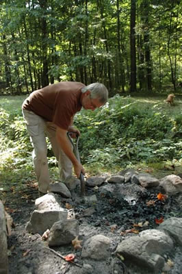 Jim C. clears the firepit.