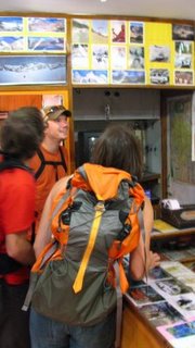 Fred, Ben and Janet looking at the postcard that inspired this adventure.