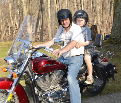 Henry Cregar - Henry may be a little young yet to have a bike but he has already started saving for his first motorcycle. Here Uncle Chip is giving him a ride and a few pointers.