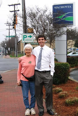 Mom & Adam in front of his work.