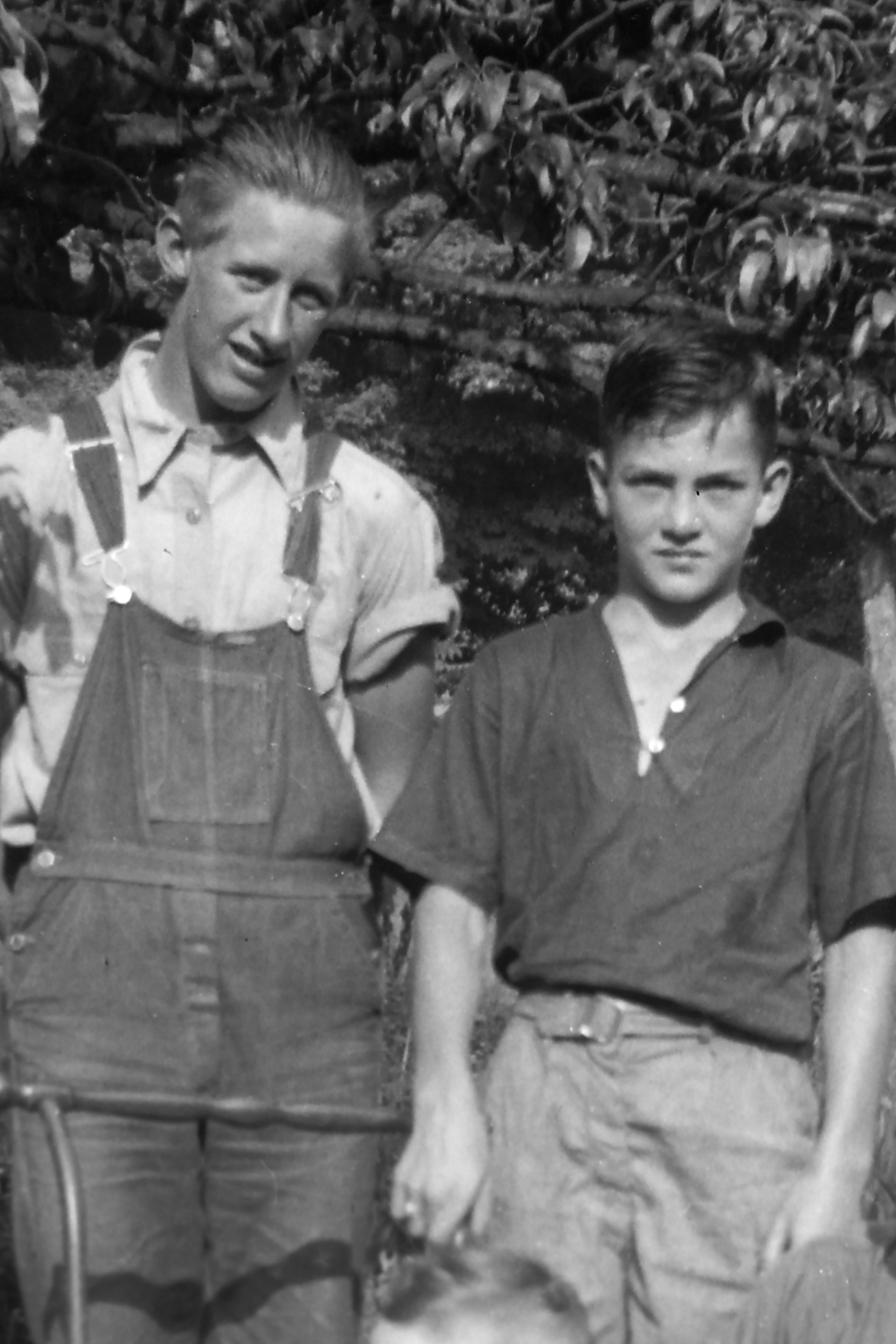 Gene on the right, not sure who the friend in the overalls is.
