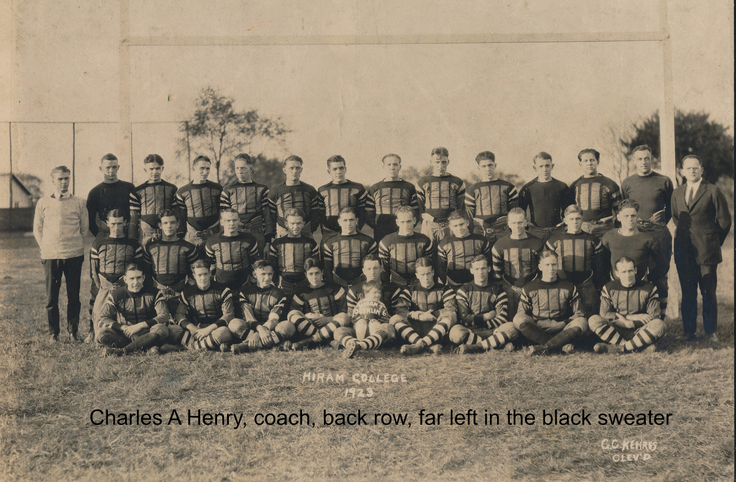 Charles A Henry, coach, back row, far left in the black sweater