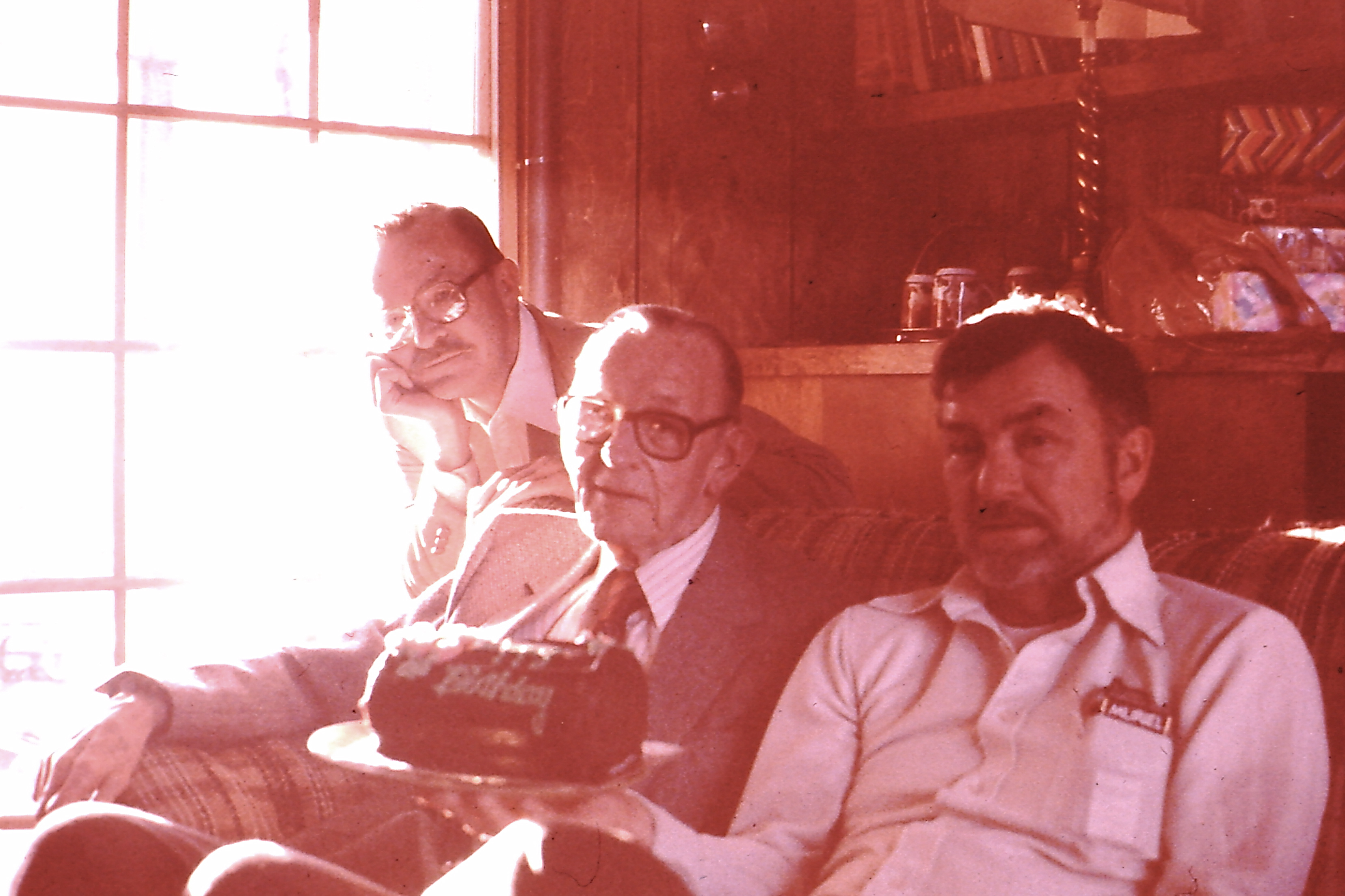 Fred and Gene celebrating a birthday with their Dad, Chuck